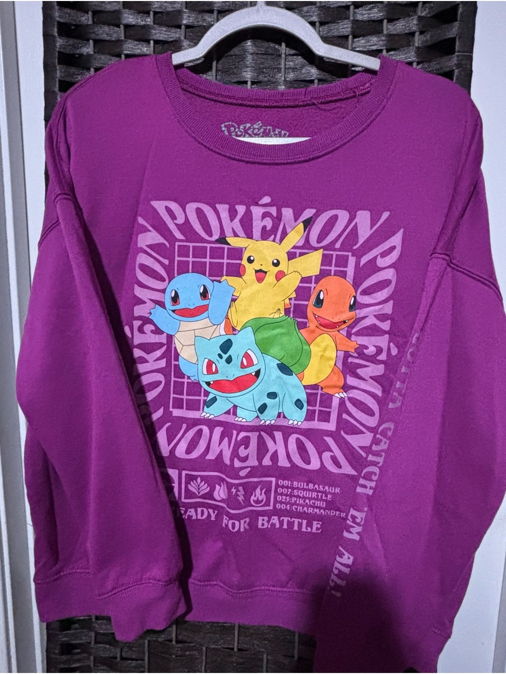 Women’s size M Crewneck Pokemon Sweatshirt in Purple with Iconic Characters.